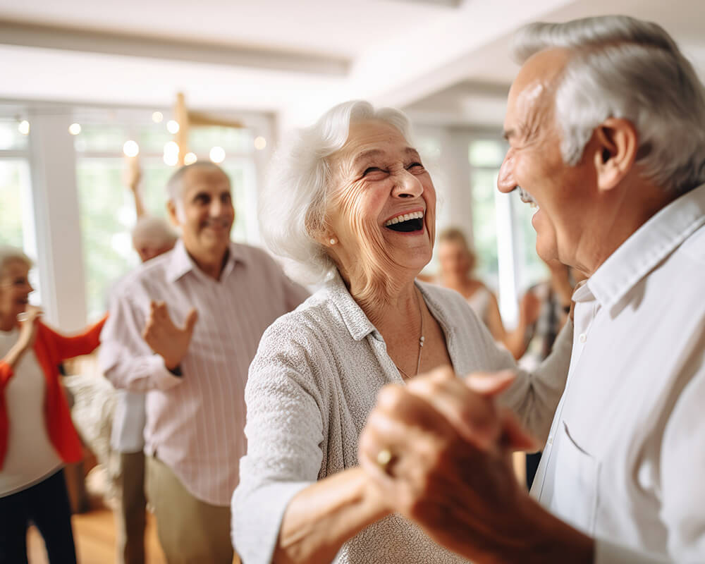Senior couple dances at a party